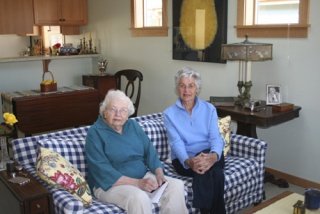 Kathaleen Larsen (l) and Gale McCallum (r) in her new cottage at LOHO.