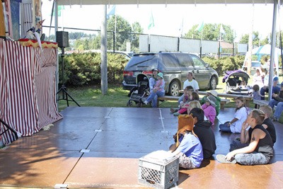 An audience is  captivated by “The Sorcerer’s Apprentice” at the  2011 San Juan Country Fair.