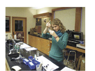 Student Laura Strom analyzes water samples from a variety of wells on Lopez Island.