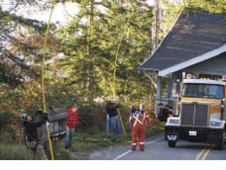 OPALCO crew helps with move of salvaged house