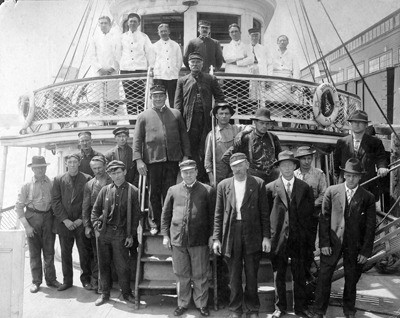 Captain Sam Barlow (third step up in center) with his crew on the Steamer Rosalie.