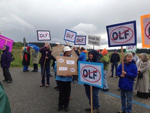 Image Credit: file photoMembers of Citizens of Ebey’s Reserve and other residents protest Navy jet noise at OLF Coupeville a couple of years ago.