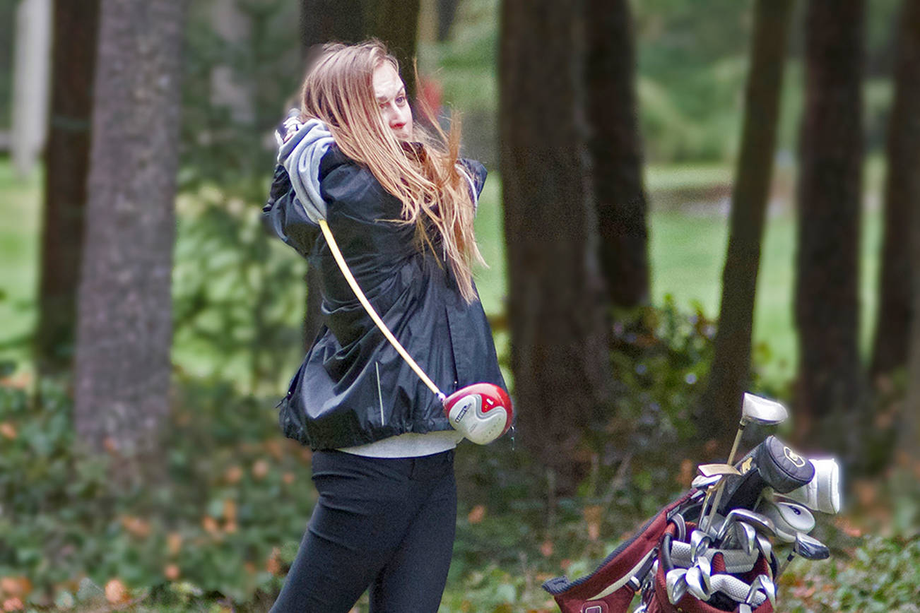 Kate Combs drives off the 6th tee at the Lopez golf course in the April 4 match versus Friday Harbor. Combs won top honors against Grace Academy on March 23. Photo by Gene Helfman.