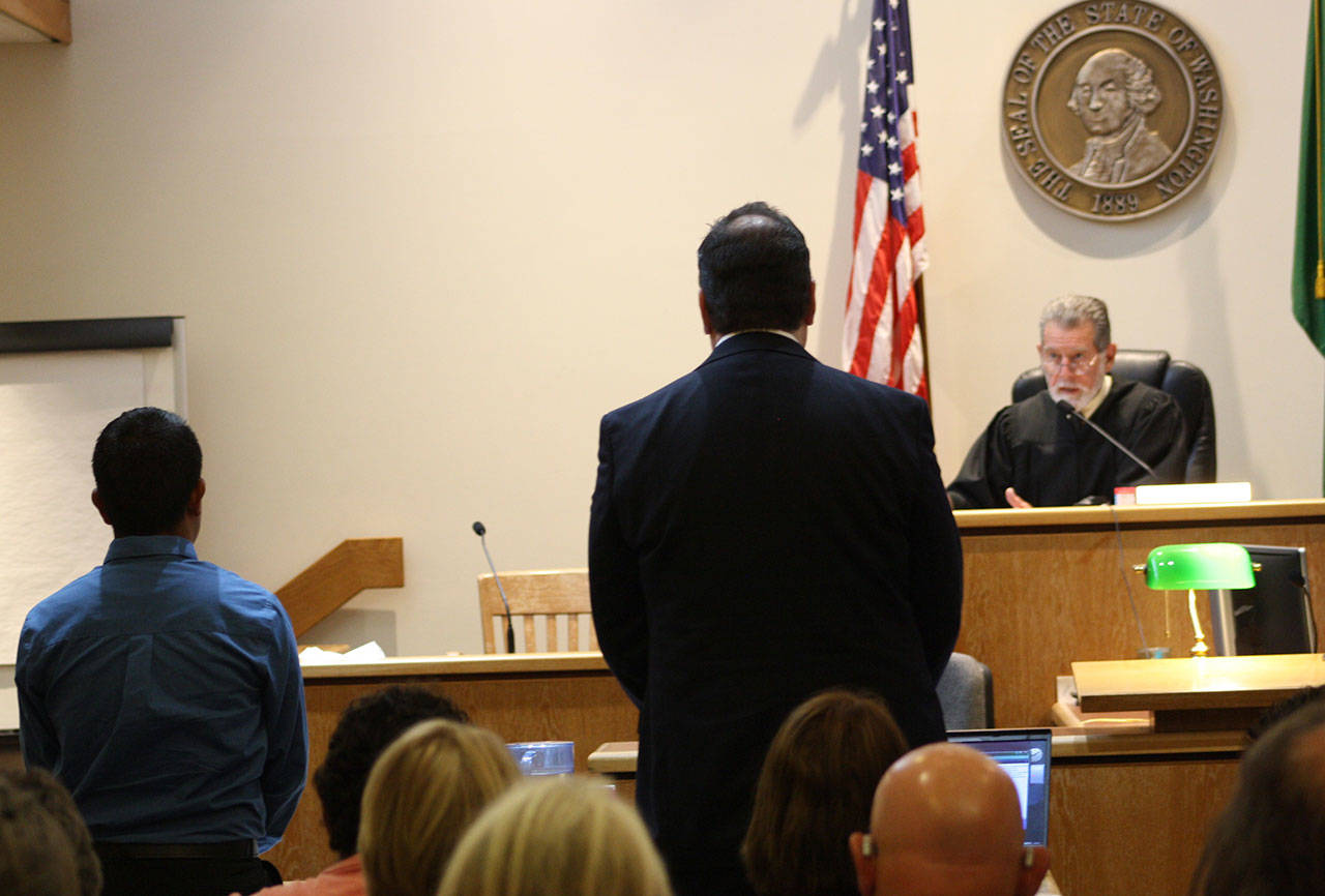 Staff photo/Hayley Day                                The defendant Jose Cruz Churape-Martinez and his lawyer Steve Brandli stand in front of Judge Donald Eaton in San Juan County Superior Court.