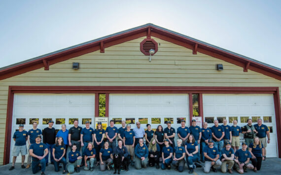 Robert Harrison photo
Back row, left to right: Basil Gunn (logistics) Andrew Robin (former EMT), Duane Bordvick (commissioner), Becky Smith (commissioner), Adam Bigby (fire Chief), Mike Reinmuth (ff), Mariah Honeywell (ff), Caleb Pal (captain paramedic), David Rucker (FD/EMT), Bo Walker (ff), Richard Tetú, (ff lieutenant), Ronni Klompus (EMT), Renee Koplan (EMT), Dave Hellman (ff), Page Reed (Logistics), Ken Aufderhar (Logistics), Monte Midkiff (logistics Lieutenant), Jim Ghiglione (former logistics), Justin Hagge (ff/EMT), Corky Searls (Logistics), Sam Fowler (ff/EMT), Rob Nou (ff/Lieutenant). Bottom row, left to right: JK Honeywell (ff/Lieutenant), Kim Herrenkohl (retired Administrative assistant), Chelsea Avery (EMT), Donna Hasbrouck (EMT), Audrey Wakefield (Logistics), Nicole O’Bryant (Captain Paramedic), Mose (a good boy), Michelle Mcdarmont (Captain Paramedic), Emma Hatchel (former EMS student), Megan Crandell (EMT), Oliver Henderson (former ff), Aimee Stephens (former ff/EMT), Monico Mackinnon (ff lieutenant/EMT), Joel Ray (former firefighter), Brian Silverstein (logistics), Emma Ewert (EMT). Not all volunteers are pictured here.