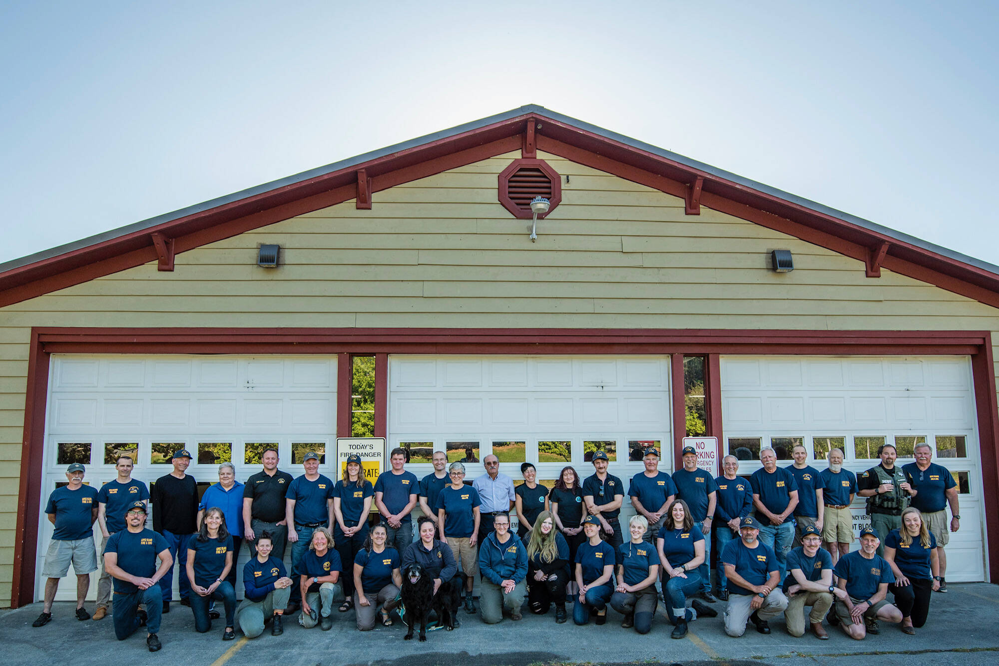 Robert Harrison photo
Back row, left to right: Basil Gunn (logistics) Andrew Robin (former EMT), Duane Bordvick (commissioner), Becky Smith (commissioner), Adam Bigby (fire Chief), Mike Reinmuth (ff), Mariah Honeywell (ff), Caleb Pal (captain paramedic), David Rucker (FD/EMT), Bo Walker (ff), Richard Tetú, (ff lieutenant), Ronni Klompus (EMT), Renee Koplan (EMT), Dave Hellman (ff), Page Reed (Logistics), Ken Aufderhar (Logistics), Monte Midkiff (logistics Lieutenant), Jim Ghiglione (former logistics), Justin Hagge (ff/EMT), Corky Searls (Logistics), Sam Fowler (ff/EMT), Rob Nou (ff/Lieutenant). Bottom row, left to right: JK Honeywell (ff/Lieutenant), Kim Herrenkohl (retired Administrative assistant), Chelsea Avery (EMT), Donna Hasbrouck (EMT), Audrey Wakefield (Logistics), Nicole O’Bryant (Captain Paramedic), Mose (a good boy), Michelle Mcdarmont (Captain Paramedic), Emma Hatchel (former EMS student), Megan Crandell (EMT), Oliver Henderson (former ff), Aimee Stephens (former ff/EMT), Monico Mackinnon (ff lieutenant/EMT), Joel Ray (former firefighter), Brian Silverstein (logistics), Emma Ewert (EMT). Not all volunteers are pictured here.