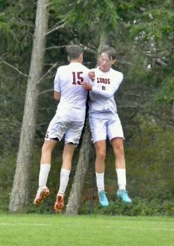 Contributed photo by Gene Helfman
Ethan Patrick (15) and Andris Meissner (11) celebrate Meissner’s goal in the second half against Friday Harbor. Patrick scored three times and Meissner twice in the Lobos’ 7-1 victory over the Wolverines Oct. 8th.