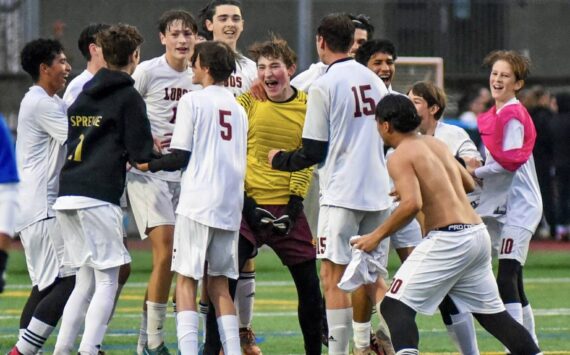 Contributed photo by Lorelei Meissner
Jubilant Lopez players celebrate their 1-0 district championship win against Orcas High on Nov. 9th. The win qualified the Lobos for the quarter-finals of the state championship. Stay tuned.