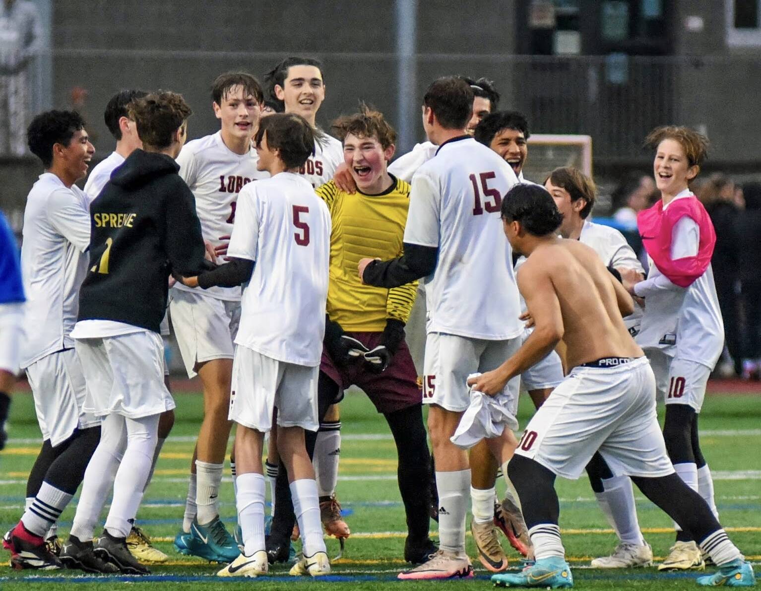 Contributed photo by Lorelei Meissner
Jubilant Lopez players celebrate their 1-0 district championship win against Orcas High on Nov. 9th. The win qualified the Lobos for the quarter-finals of the state championship. Stay tuned.